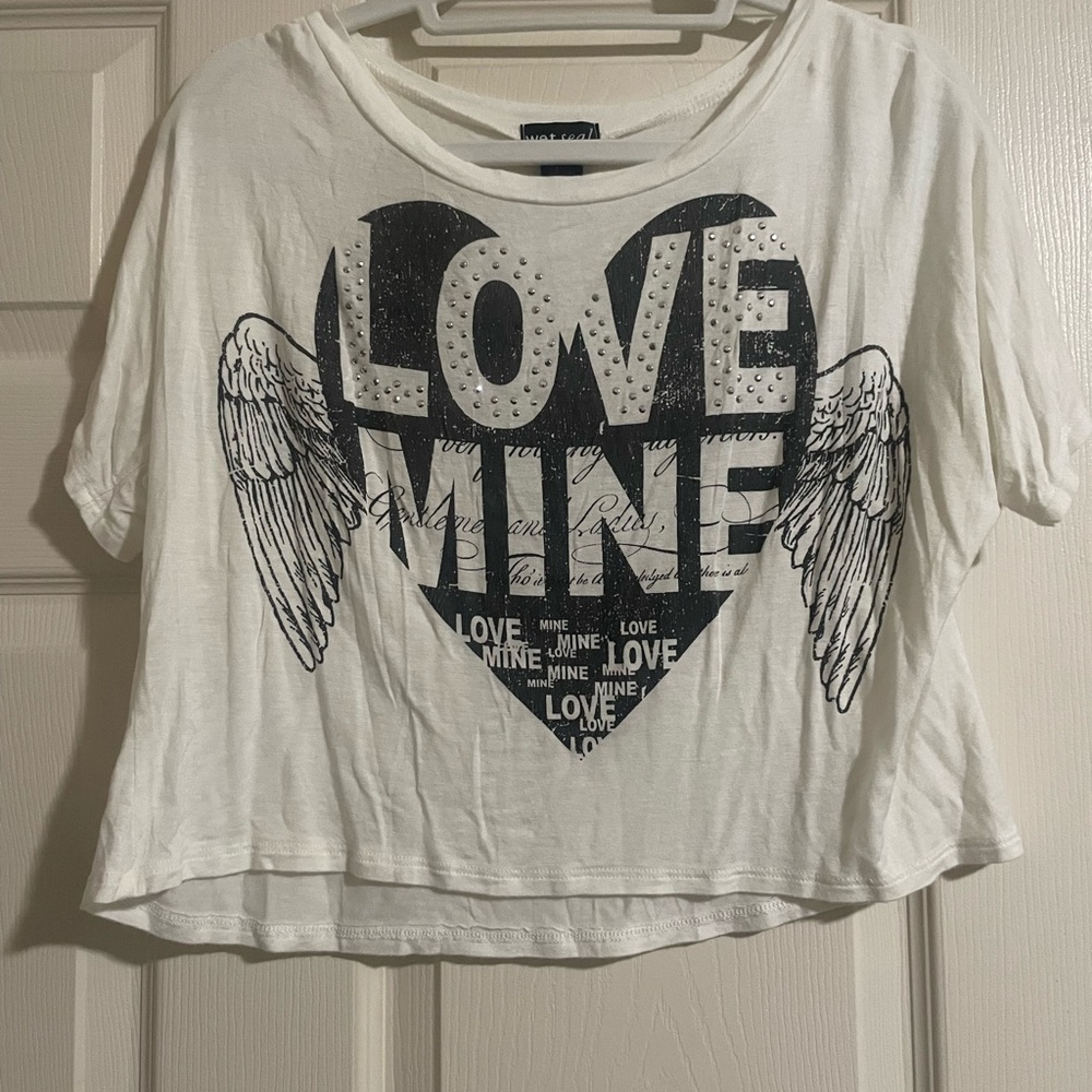 White and black graphic top. Small silver rhinestone accents.